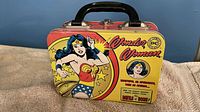 Front view closed showing Wonder Woman artwork and handle