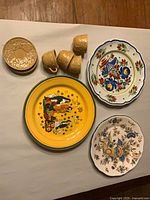 Overall lot layout showing plates, cups, lid