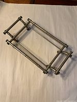 Perspective view of entire metal faux bamboo casserole holder