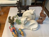 Group shot of all nine animal figurines on white background