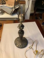 Full lamp showing harp, socket, and decorative stem