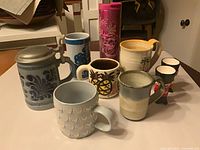 Group shot of all mugs, stein, tumbler and egg cups