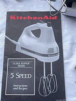 Front of KitchenAid booklet showing mixer model