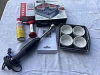 All items grouped: blender, torch, fuel, crème brûlée set components