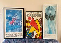 Front view of all three framed prints standing side by side