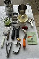 Overview of all kitchen gadgets spread on table