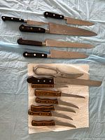 Group view of all knives on cloth