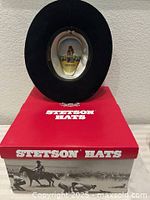 Hat resting on Stetson box showing overall shape and box graphics