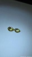 Pair of yellow-green fancy cut chrysoberyl gemstones