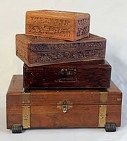 Stacked view of all four wooden boxes showing sizes and hardware