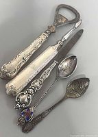 All five sterling-handled pieces overlapped