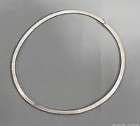 Full view of 16" flat omega sterling necklace in circle form