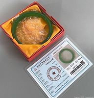 bangle in presentation box with certificate visible