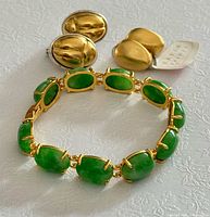 Group shot of jade bracelet and two pairs of earrings