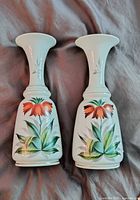 Front view of both matching vases showing floral painting