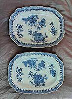 Front view of both platters showing floral decoration