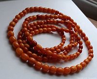 Coiled strand showing overall color and graduated bead sizes