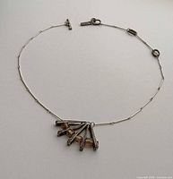 Entire necklace laid flat showing chain, clasp, and pendant