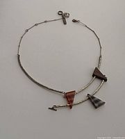 Full view of necklace laid flat showing entire design