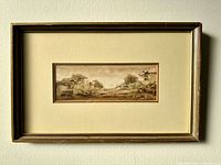 Framed watercolour painting on wall