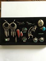 Overall lot on velvet tray showing all twelve pieces