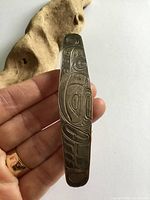 Front view showing carved design over full length