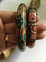 Both painted bangles side by side showing exterior designs