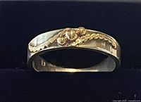 Top view of sterling band ring with 14k gold accent