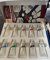 Open box showing 10 gouache paint tubes in foam tray