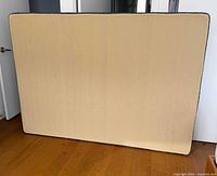 Front view of double box spring standing upright