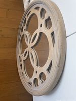 Side view of round cutout mirror showing frame depth and design