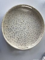 Full view of round resin tray showing overall design and handles