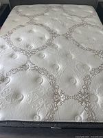 Top view of queen mattress showing quilted surface and pattern
