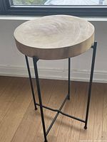 Full view of round wood side table front