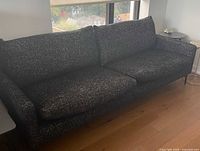 Front view of full sofa showing cushions, arms and legs