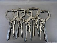 Five locking C-clamp pliers laid out