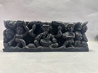 Front view of carved panel with four figures