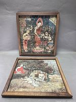 Both framed Thai paintings front view
