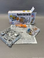 Box, instruction sheet, sealed parts bags on table