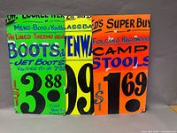 Three signs side by side showing products and prices