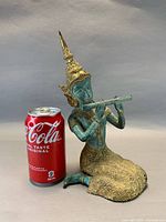 Front view with soda can for scale showing entire sculpture