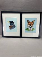 Both framed prints side by side