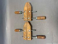Top view of two wooden handscrew clamps showing jaws, screws, and handles