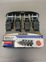 Front view of packaged 4-pack Car and Driver Rubber Grip Tie-Downs