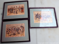 All three framed uniform prints together