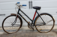 Full right side view of Huffy girls bicycle showing frame, wheels, fenders, chain guard