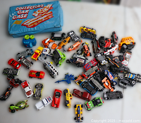 Lot overview showing blue Collectors Car Case and assortment of diecast vehicles