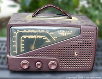 Front view showing dial, knobs, grille and condition