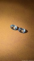 Pair of oval aquamarines top view showing color and brilliance