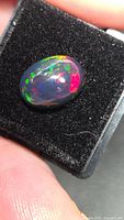 Top view of Ethiopian black opal showing multicolor play-of-color